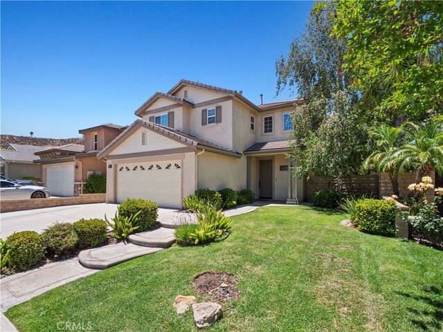 28323 Roman Ct, Saugus, CA 91350 - traditional home with stucco siding, driveway, a front yard, a garage, and a tile roof