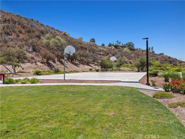 28323 Roman Ct, Saugus, CA 91350 - view of grassy yard featuring community basketball court and a mountain view