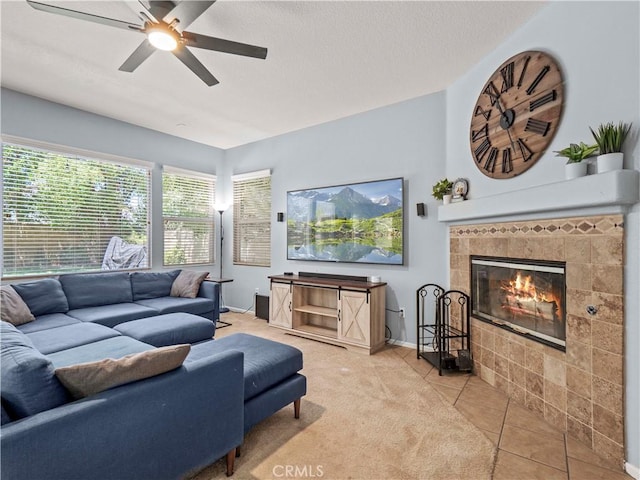28323 Roman Ct, Saugus, CA 91350 - living room featuring a ceiling fan, a tile fireplace, tile patterned flooring, a textured ceiling, and carpet