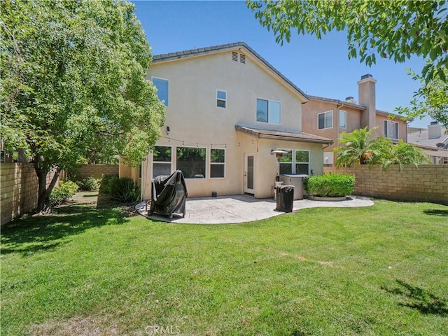 28323 Roman Ct, Saugus, CA 91350 - back of house featuring a chimney, stucco siding, a fenced backyard, and a patio