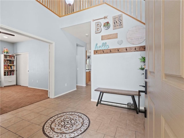 28323 Roman Ct, Saugus, CA 91350 - carpeted foyer entrance featuring a high ceiling and tile patterned flooring