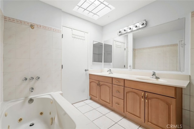 429 E Providencia Ave Unit B, Burbank, CA 91501 - bathroom featuring a tub with jets, double vanity, and tile patterned flooring
