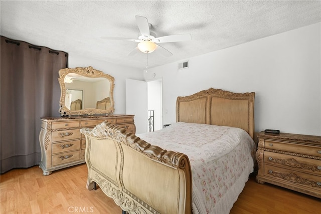 429 E Providencia Ave Unit B, Burbank, CA 91501 - bedroom with light wood-type flooring, a textured ceiling, and a ceiling fan