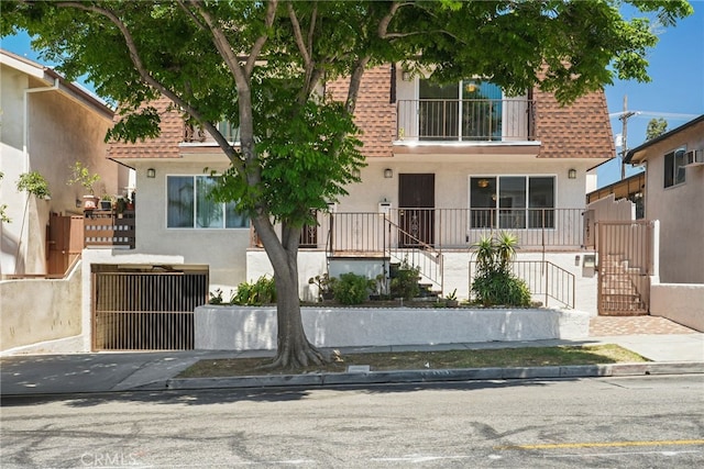 429 E Providencia Ave Unit B, Burbank, CA 91501 - view of front of house with stucco siding, stairs, and roof with shingles