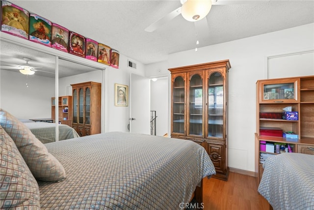 429 E Providencia Ave Unit B, Burbank, CA 91501 - bedroom with wood finished floors, a textured ceiling, and a ceiling fan