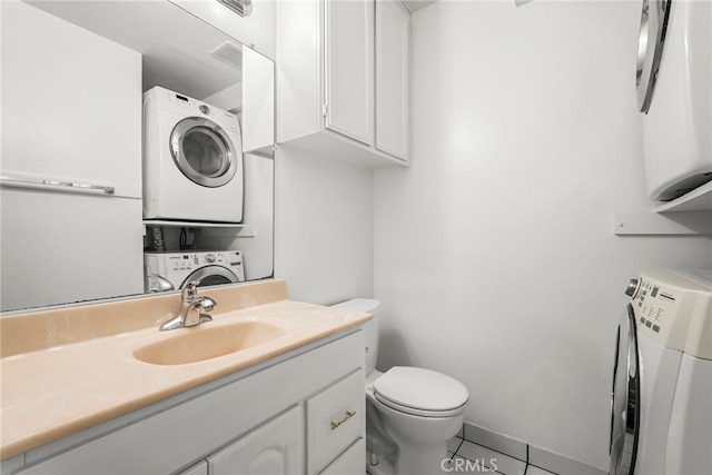 429 E Providencia Ave Unit B, Burbank, CA 91501 - bathroom featuring estacked washer and dryer, vanity, and tile patterned flooring