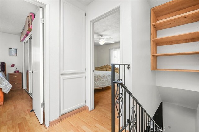 429 E Providencia Ave Unit B, Burbank, CA 91501 - hall featuring an upstairs landing, light wood-style flooring, and a textured ceiling