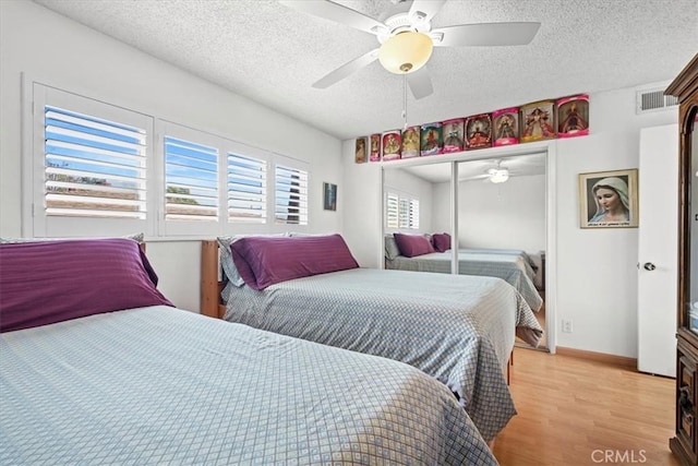 429 E Providencia Ave Unit B, Burbank, CA 91501 - bedroom with a textured ceiling, light wood finished floors, a closet, and ceiling fan