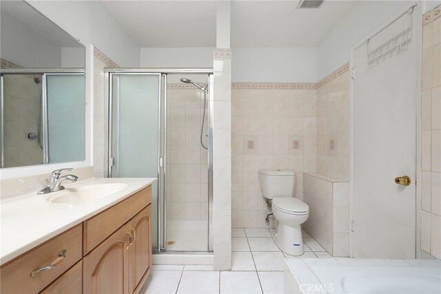429 E Providencia Ave Unit B, Burbank, CA 91501 - full bathroom with vanity, a stall shower, tile patterned floors, and tile walls