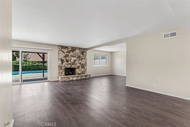 6304 Tamarind St, Oak Park, CA 91377 - unfurnished living room featuring dark wood-type flooring and a fireplace