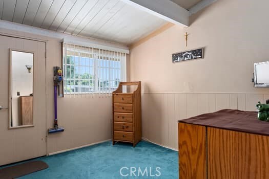 17059 E Groverdale St, Covina, CA 91722 - interior space featuring carpet floors, beamed ceiling, and wainscoting