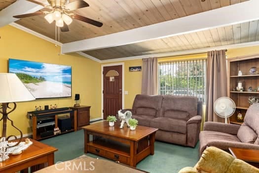 17059 E Groverdale St, Covina, CA 91722 - living area with a wood ceiling with exposed beams, carpet floors, a ceiling fan, and crown molding