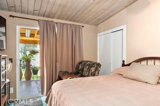 17059 E Groverdale St, Covina, CA 91722 - bedroom with access to outside, a closet, and wood ceiling