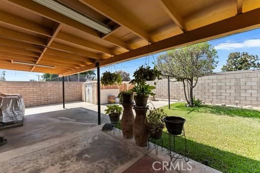 17059 E Groverdale St, Covina, CA 91722 - fenced backyard with a patio area and a storage unit
