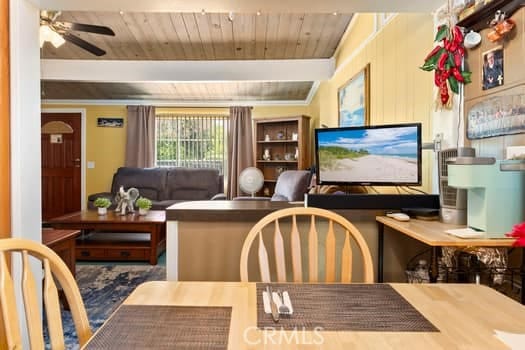 17059 E Groverdale St, Covina, CA 91722 - living room with ceiling fan and a wood ceiling with exposed beams