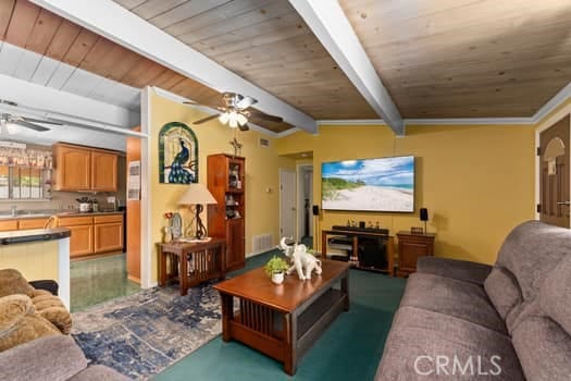 17059 E Groverdale St, Covina, CA 91722 - living room featuring a ceiling fan and a wood ceiling with exposed beams