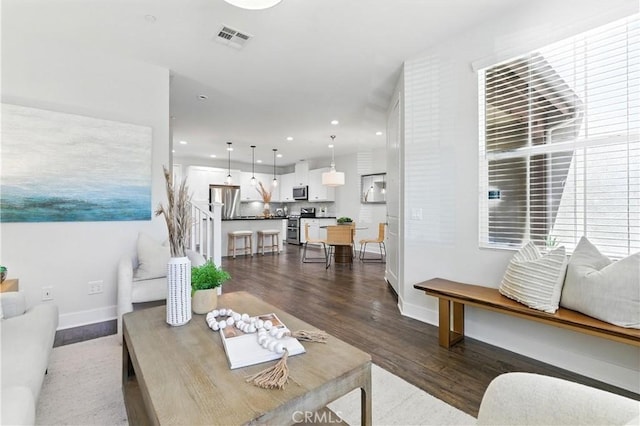 28 Sembrio St, Rancho Mission Viejo, CA 92694 - living area featuring dark wood finished floors and recessed lighting