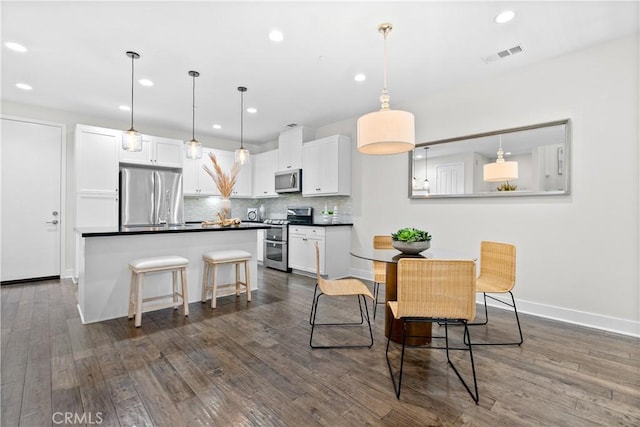 28 Sembrio St, Rancho Mission Viejo, CA 92694 - dining space with recessed lighting and dark wood-style floors