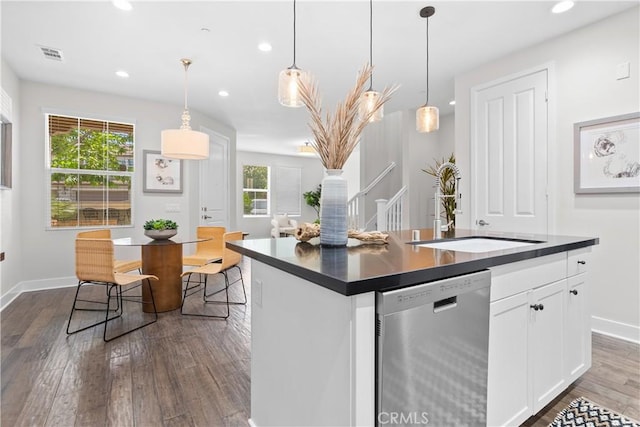 28 Sembrio St, Rancho Mission Viejo, CA 92694 - kitchen featuring dishwasher, dark countertops, dark wood-type flooring, white cabinetry, and recessed lighting