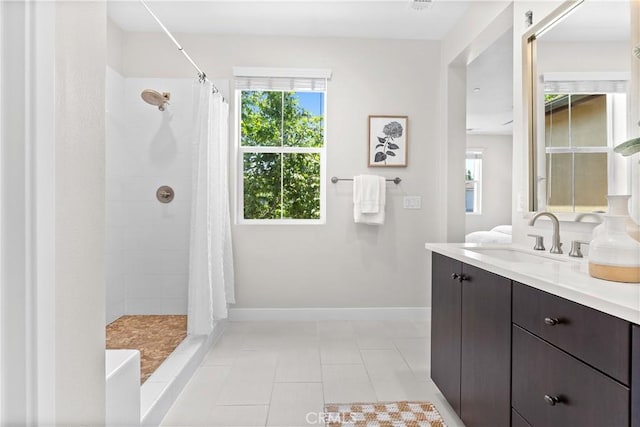 28 Sembrio St, Rancho Mission Viejo, CA 92694 - bathroom with vanity, healthy amount of natural light, tiled shower, and tile patterned flooring