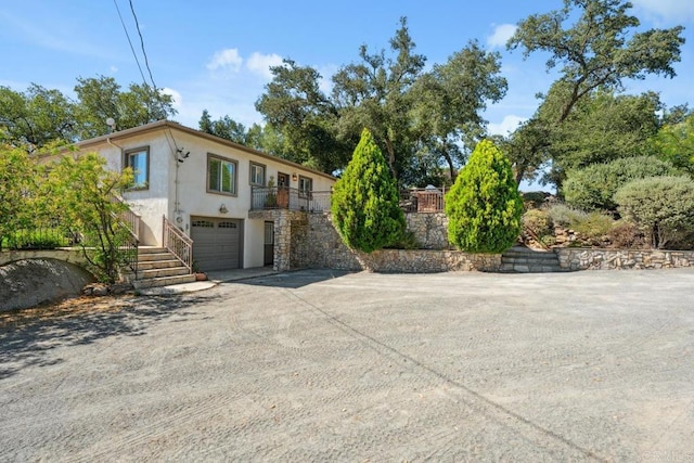 1480 Round Potrero Rd, Potrero, CA 91963 - view of front of home with driveway, stucco siding, an attached garage, and stairway
