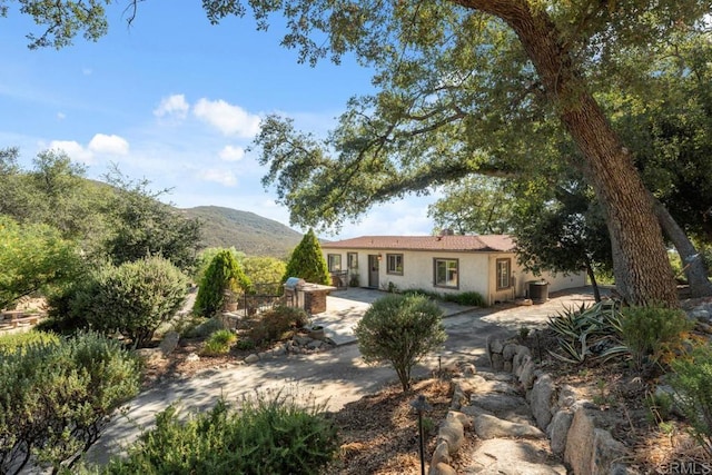 1480 Round Potrero Rd, Potrero, CA 91963 - view of front of property with stucco siding, a patio area, and a mountain view