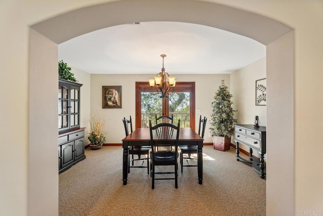1480 Round Potrero Rd, Potrero, CA 91963 - carpeted dining space with a chandelier and arched walkways
