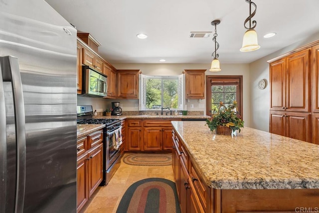 1480 Round Potrero Rd, Potrero, CA 91963 - kitchen featuring appliances with stainless steel finishes, recessed lighting, and brown cabinets