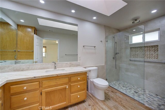 355 Via Vicente, Nipomo, CA 93444 - full bath with a skylight, vanity, wood finished floors, tiled shower, and recessed lighting