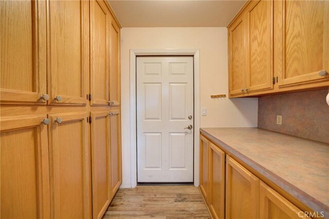 355 Via Vicente, Nipomo, CA 93444 - kitchen featuring light wood-type flooring, tasteful backsplash, and light countertops