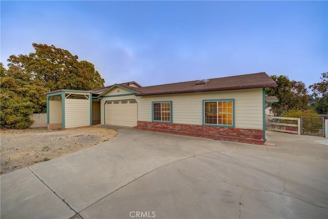 355 Via Vicente, Nipomo, CA 93444 - view of front facade featuring brick siding, an attached garage, and concrete driveway
