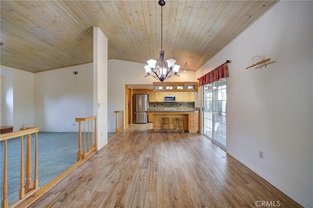 355 Via Vicente, Nipomo, CA 93444 - kitchen featuring stainless steel appliances, a chandelier, vaulted ceiling, light wood-type flooring, and open floor plan