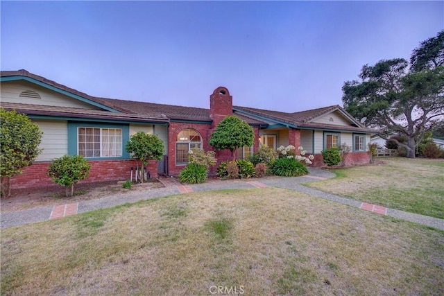 355 Via Vicente, Nipomo, CA 93444 - ranch-style home featuring a chimney, brick siding, and a front yard