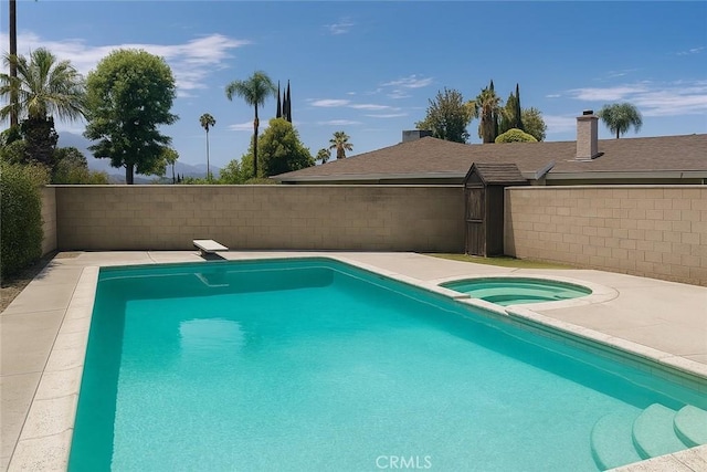 41150 Nona Ct, Hemet, CA 92544 - view of pool with an in-ground hot tub and a diving board