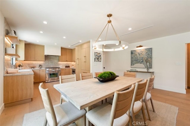 13817 Valley Vista Blvd, Sherman Oaks, CA 91423 - dining space featuring light wood-style flooring, recessed lighting, and a chandelier