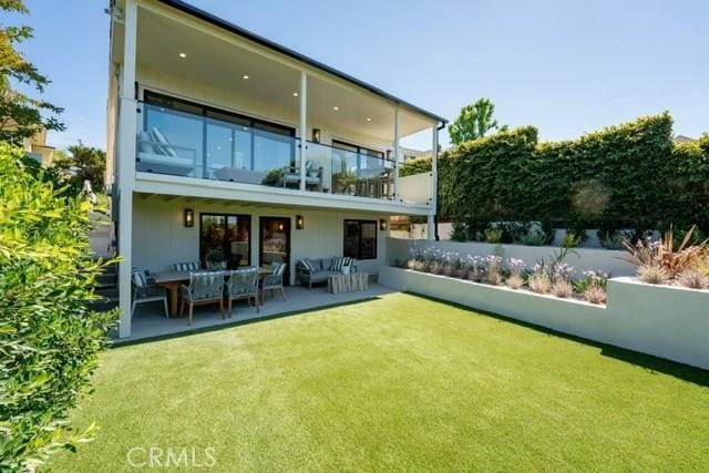 13817 Valley Vista Blvd, Sherman Oaks, CA 91423 - rear view of house with a balcony, outdoor lounge area, and a lawn