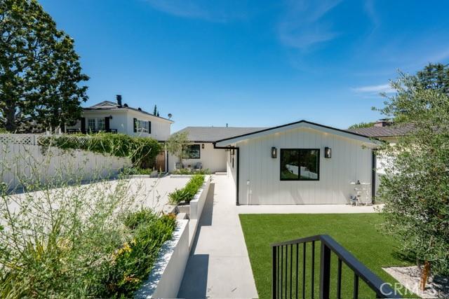 13817 Valley Vista Blvd, Sherman Oaks, CA 91423 - back of property with a yard and board and batten siding