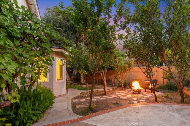 24622 Cresta Ct, Laguna Hills, CA 92653 - view of yard with an outdoor fire pit and a patio area