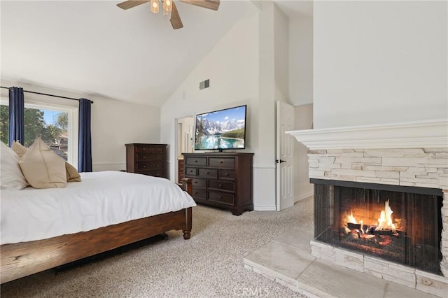 24622 Cresta Ct, Laguna Hills, CA 92653 - bedroom with high vaulted ceiling, light carpet, a stone fireplace, and ceiling fan