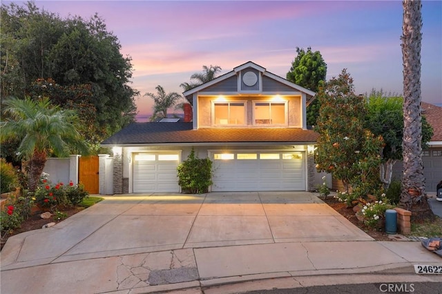 24622 Cresta Ct, Laguna Hills, CA 92653 - traditional home featuring concrete driveway, a garage, and stucco siding