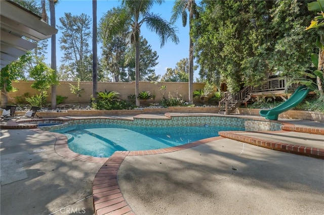 24622 Cresta Ct, Laguna Hills, CA 92653 - view of pool featuring a water slide, a fenced backyard, a patio, and a pool with connected hot tub