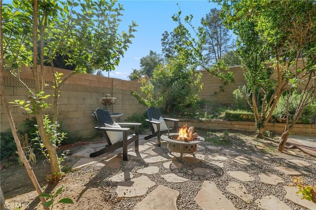 24622 Cresta Ct, Laguna Hills, CA 92653 - fenced backyard with a fire pit and a patio area