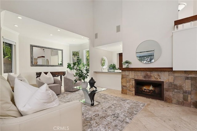 24622 Cresta Ct, Laguna Hills, CA 92653 - living room with plenty of natural light, recessed lighting, a stone fireplace, a towering ceiling, and ornamental molding