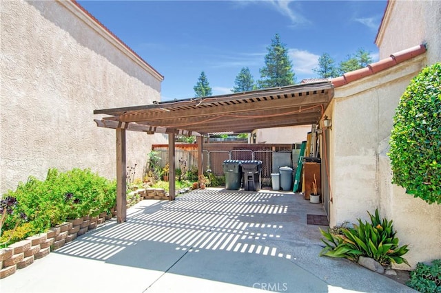 10254 Catalina Pl, Rancho Cucamonga, CA 91730 - view of patio / terrace with a pergola, concrete driveway, and a carport