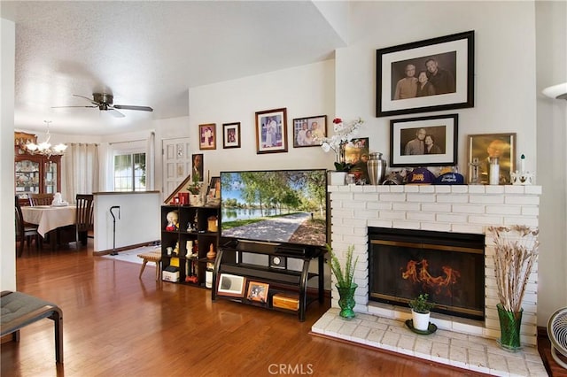 10254 Catalina Pl, Rancho Cucamonga, CA 91730 - living room featuring wood finished floors, a chandelier, a brick fireplace, and ceiling fan