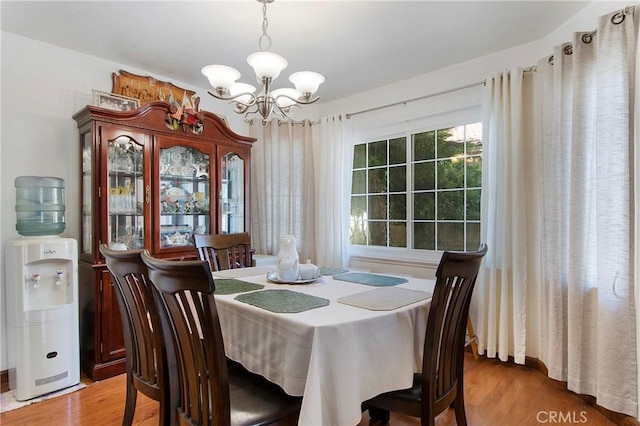 10254 Catalina Pl, Rancho Cucamonga, CA 91730 - dining area featuring a chandelier and light wood-type flooring