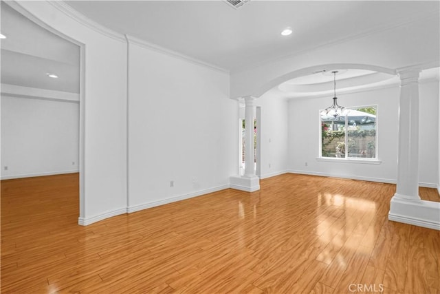 17787 Merridy St, Northridge, CA 91325 - spare room featuring ornate columns, arched walkways, recessed lighting, a chandelier, and light wood-style flooring