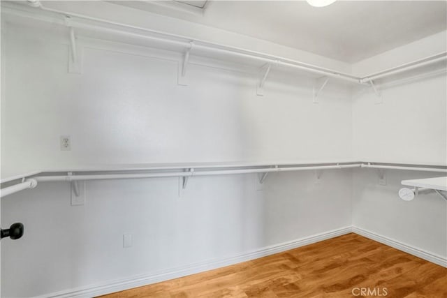 17787 Merridy St, Northridge, CA 91325 - walk in closet featuring wood finished floors