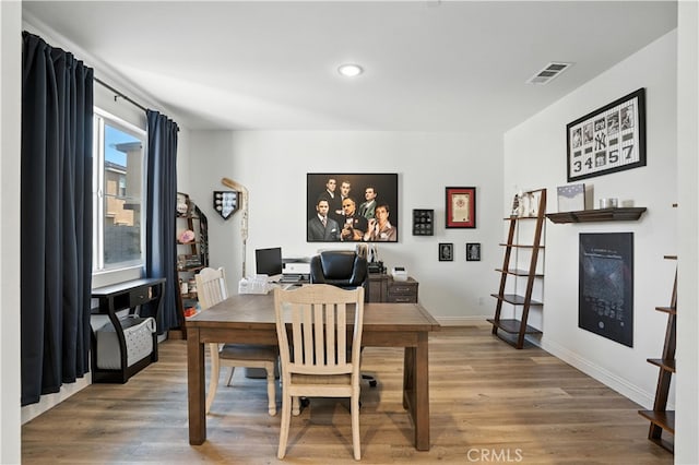 11715 Periwinkle Pl, Jurupa Valley, CA 91752 - dining room featuring light wood-type flooring, recessed lighting, and a desk