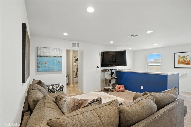 11715 Periwinkle Pl, Jurupa Valley, CA 91752 - living room with recessed lighting and light carpet